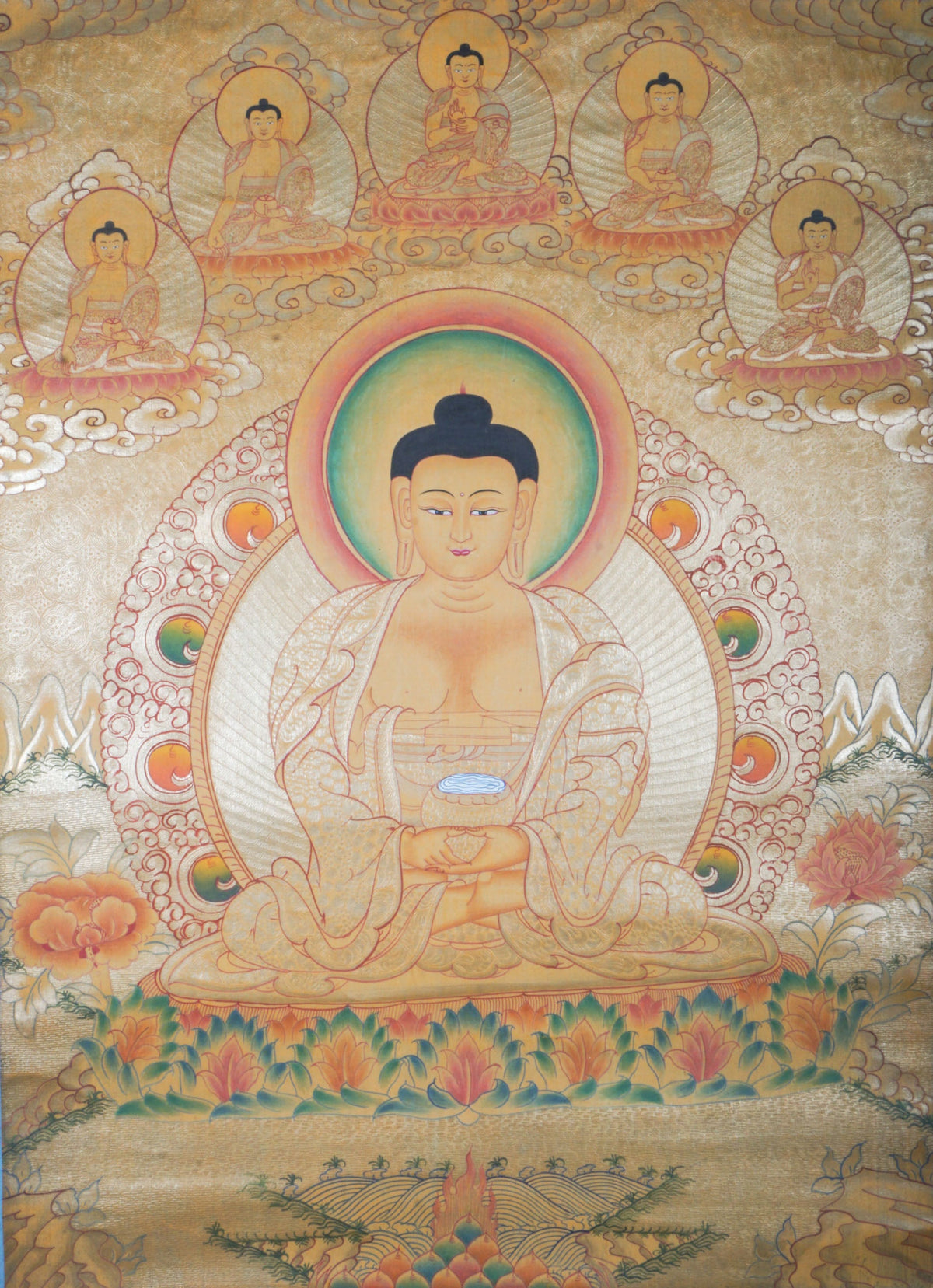 Hand-painted Tibetan Thangka of Amitabha Buddha on a gold background, the Buddha of Infinite Light seated in meditation holding a begging bowl, surrounded by celestial Buddhas, traditional Himalayan Buddhist art for Pure Land practice, meditation altar, and sacred wall decor.