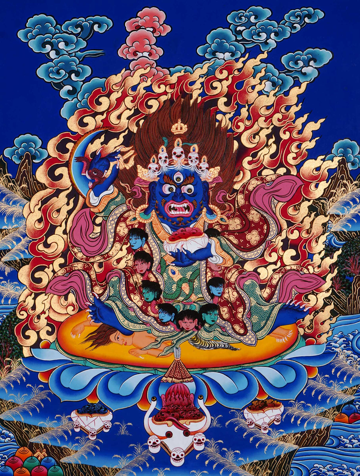 Hand-painted Mahākāla thangka from Kathmandu, Nepal depicting the wrathful protector deity with dark blue body, skull crown of five skulls, garland of severed heads, holding skull cup and curved knife, surrounded by red flames in traditional Tibetan Vajrayana style.