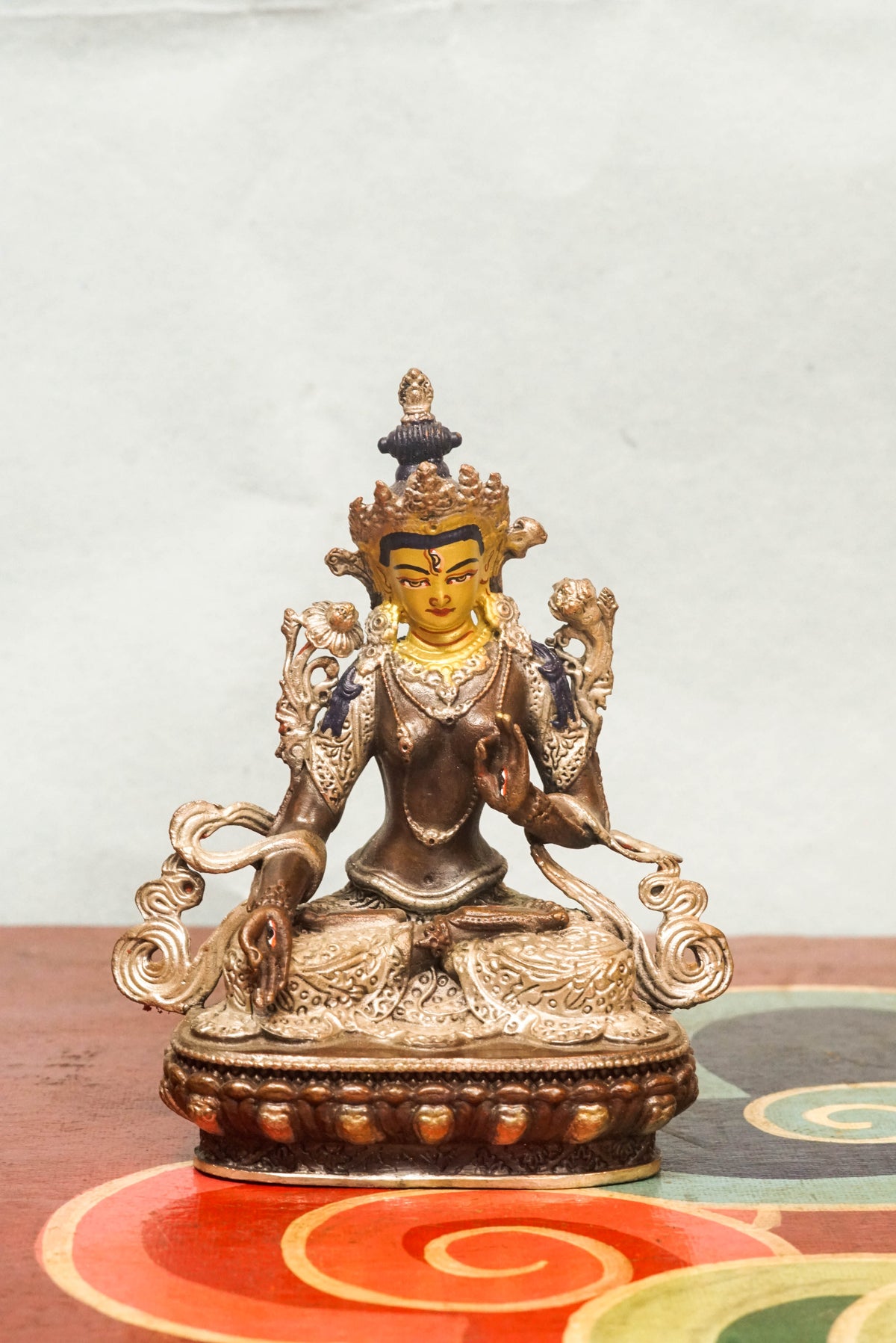 Handmade silver White Tara statue, depicting the compassionate goddess with calm expression and symbolic seven eyes.