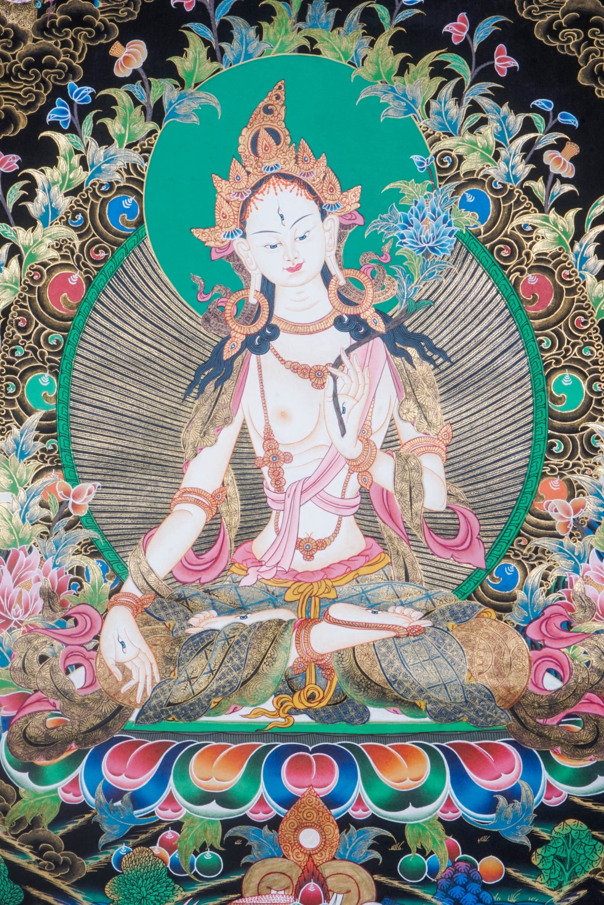 The White Tara Thangka Painting symbolizes healing, compassion, and long life, featuring the goddess with seven eyes and hand-painted using natural pigments by Tibetan artisans—perfect for spiritual growth and protection.