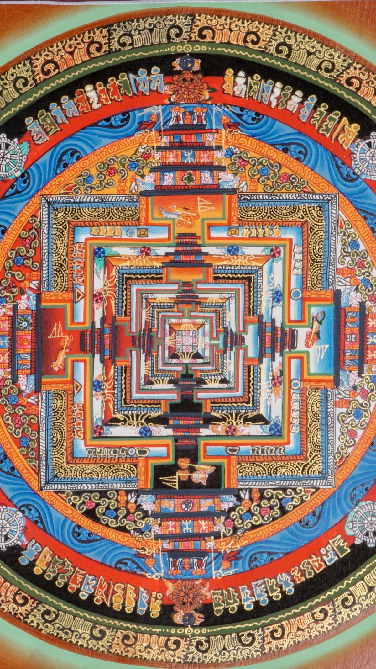 Kalachakra Mandala thangka showing a circular mandala with a square inner palace, layered gateways, concentric rings, and Tibetan script on a red background.