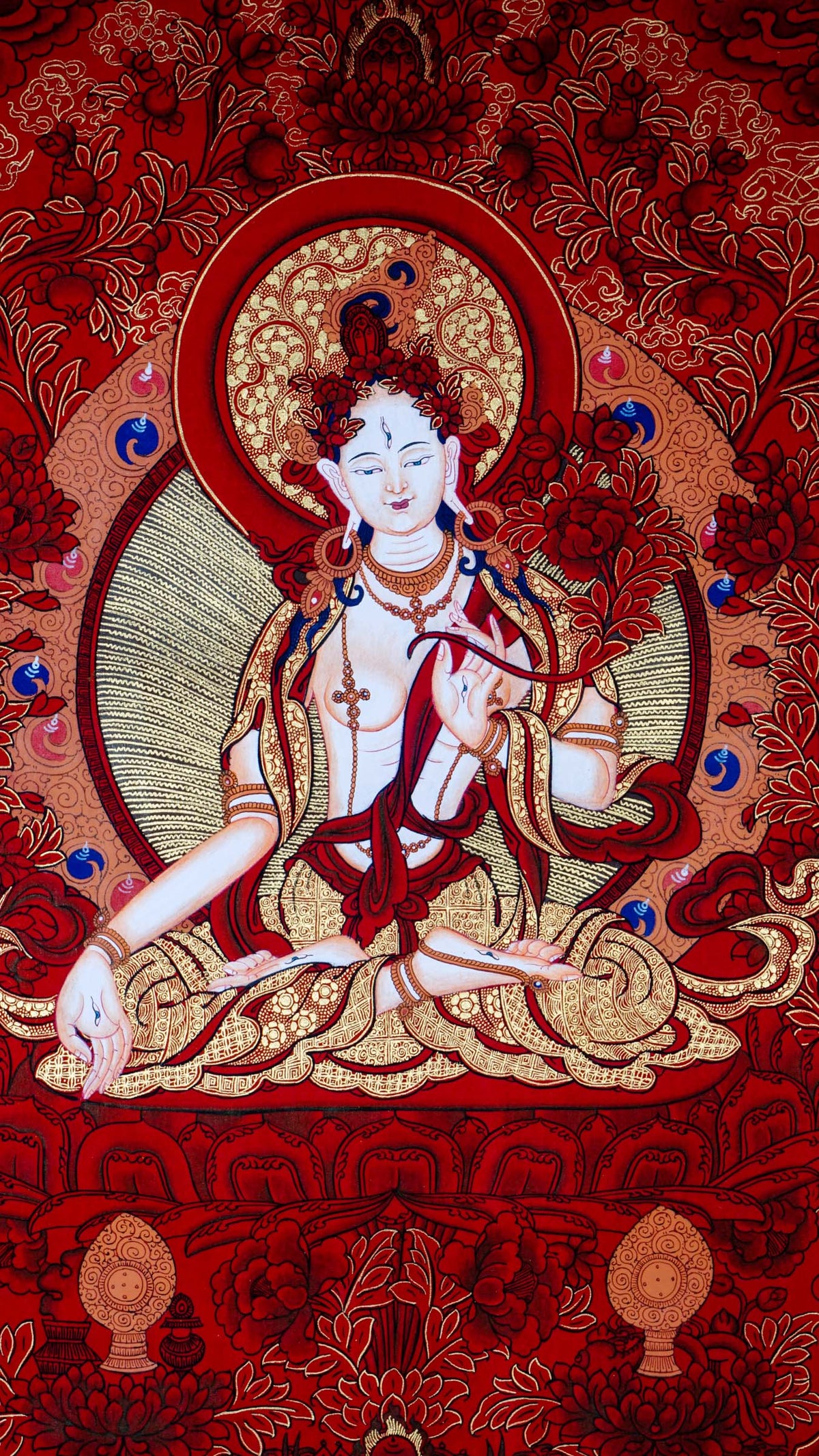 This White Tara Thangka features White Tara, a important figure in Tibetan Buddhism representing purity and calmness.