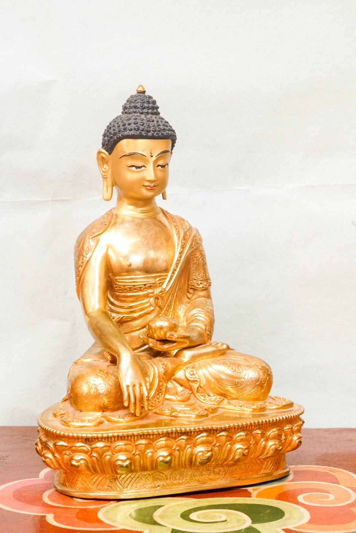 Statue of Sha Buddha, representing the historical Buddha in a meditative pose, embodying wisdom, peace, and spiritual awakening.