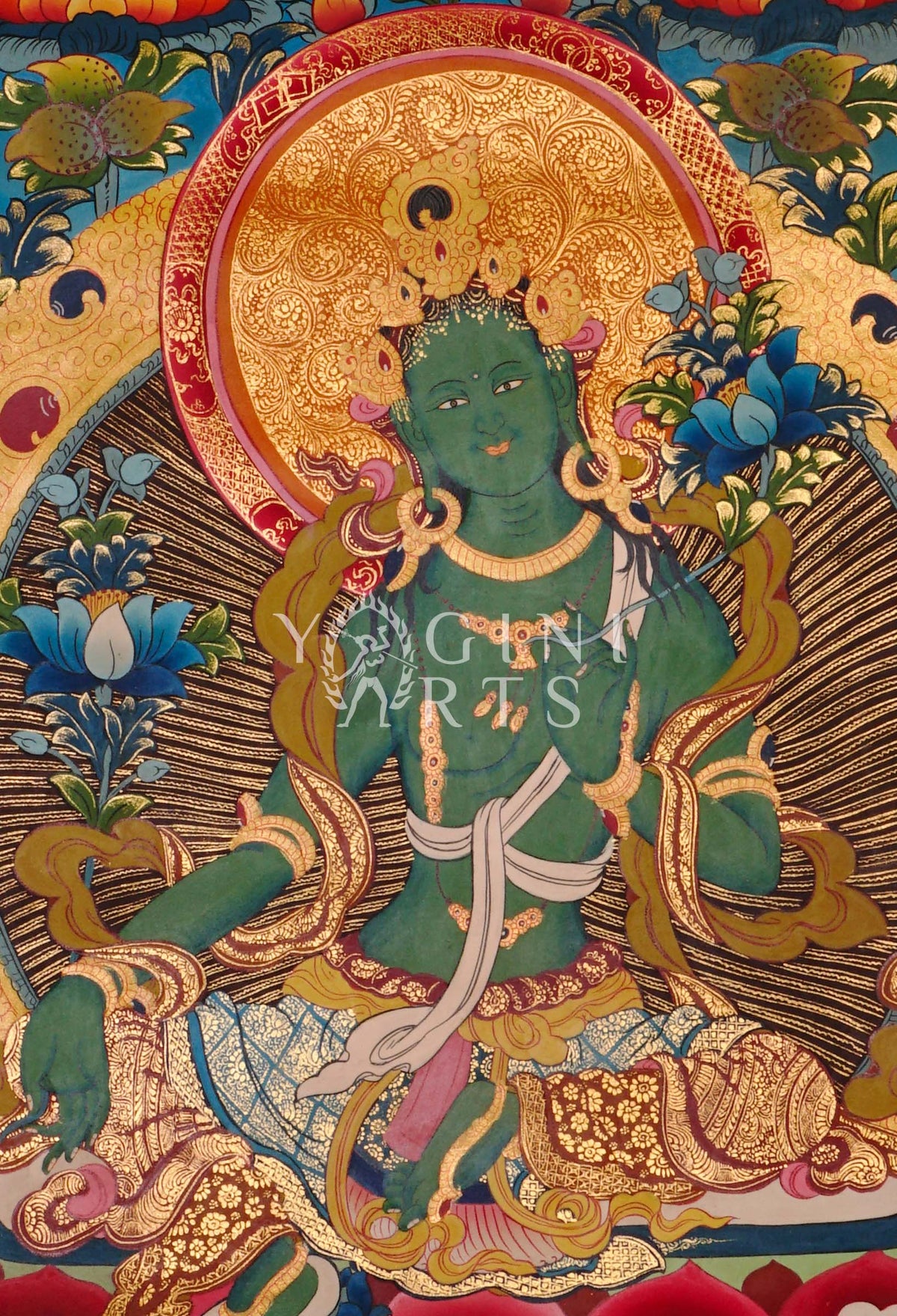 Green Tara thangka featuring the  Buddhist goddess of compassion seated on a lotus throne surrounded by vibrant sacred symbolism and gold detailing