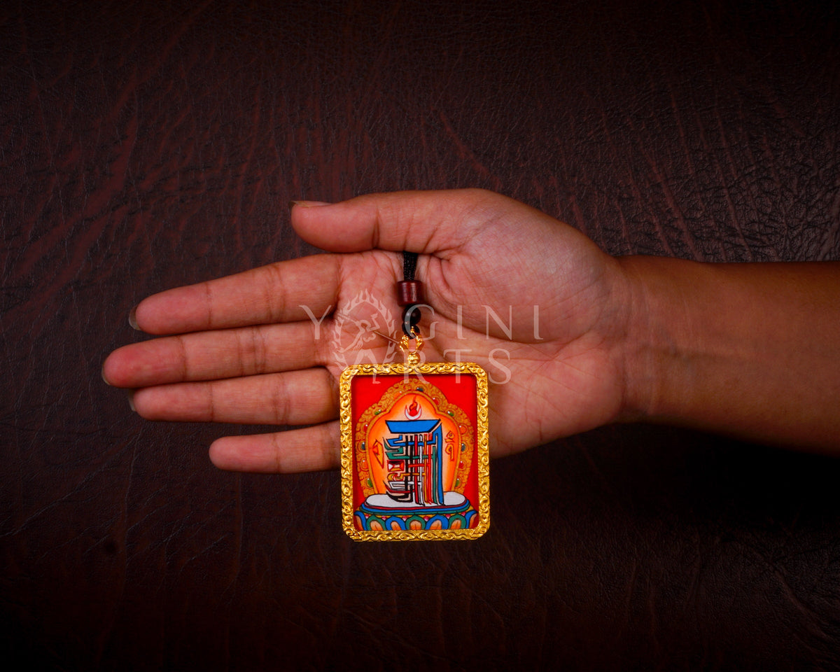 Hand-painted Kalachakra Mandala Ghau pendant in a gold-tone frame, handcrafted in Nepal using traditional Himalayan miniature painting techniques.