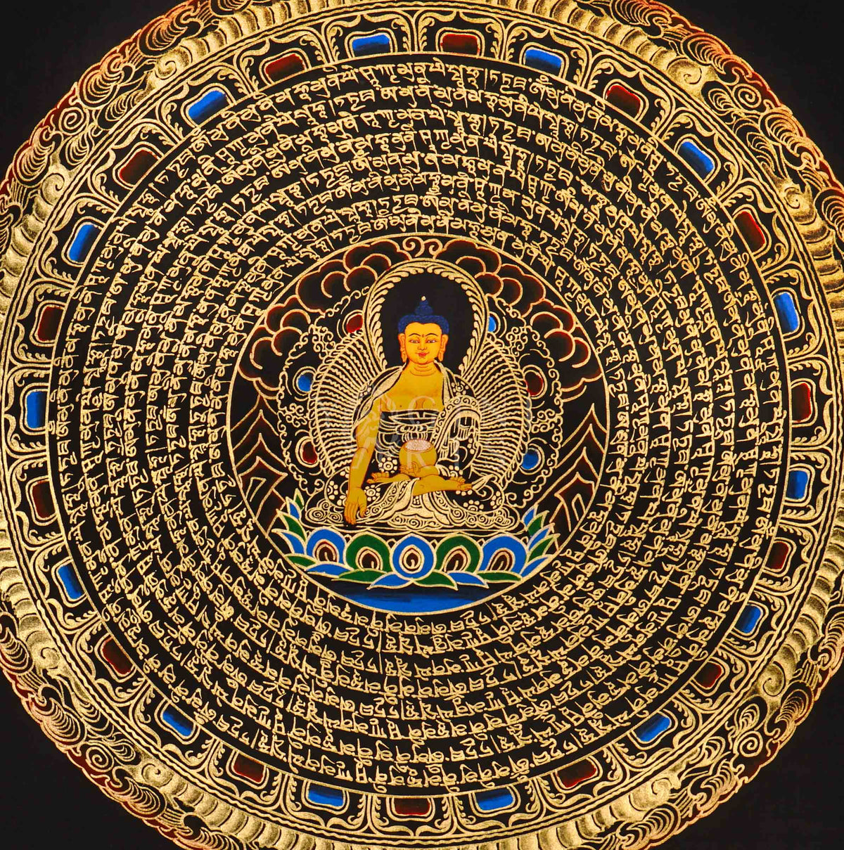 Shakyamuni Buddha mandala thangka featuring a central Buddha figure surrounded by circular Tibetan script and intricate gold detailing on a black background.